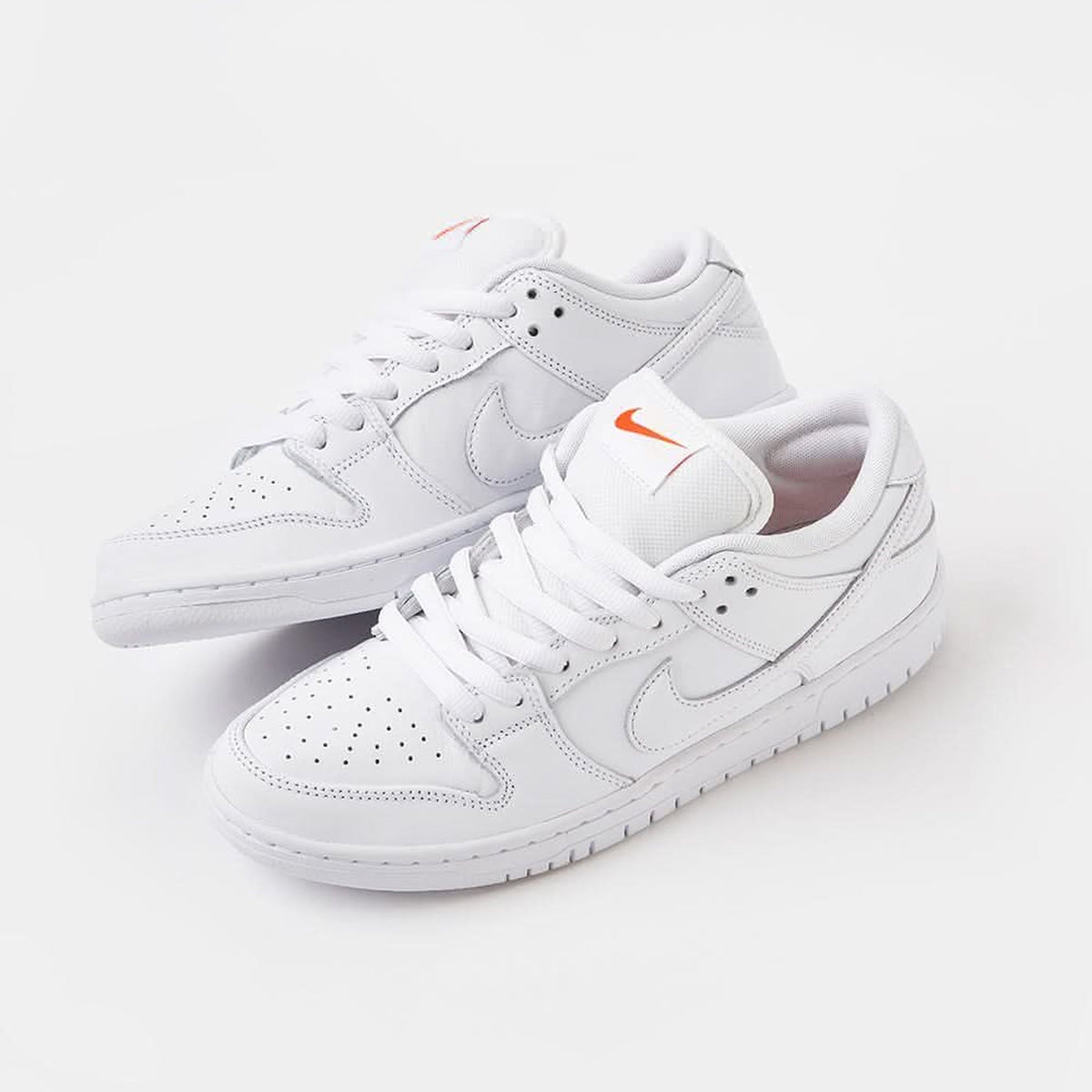 Dunk Low Pro ISO Triple White / Orange Label - Triple White / Orange Label - three-quarter pair view