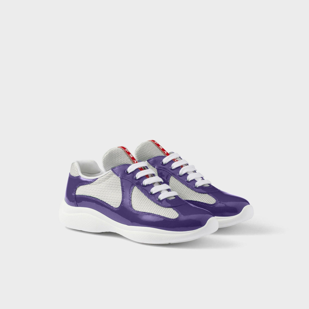 Violet patent mesh runner sneakers three-quarter view
